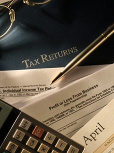International Tax Returns - image of Calculator and files
